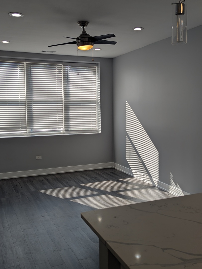 3925 South Indiana Avenue, Unit 3 Chicago, IL 60653 - Photo 4 of 11 a view of room with a ceiling fan
