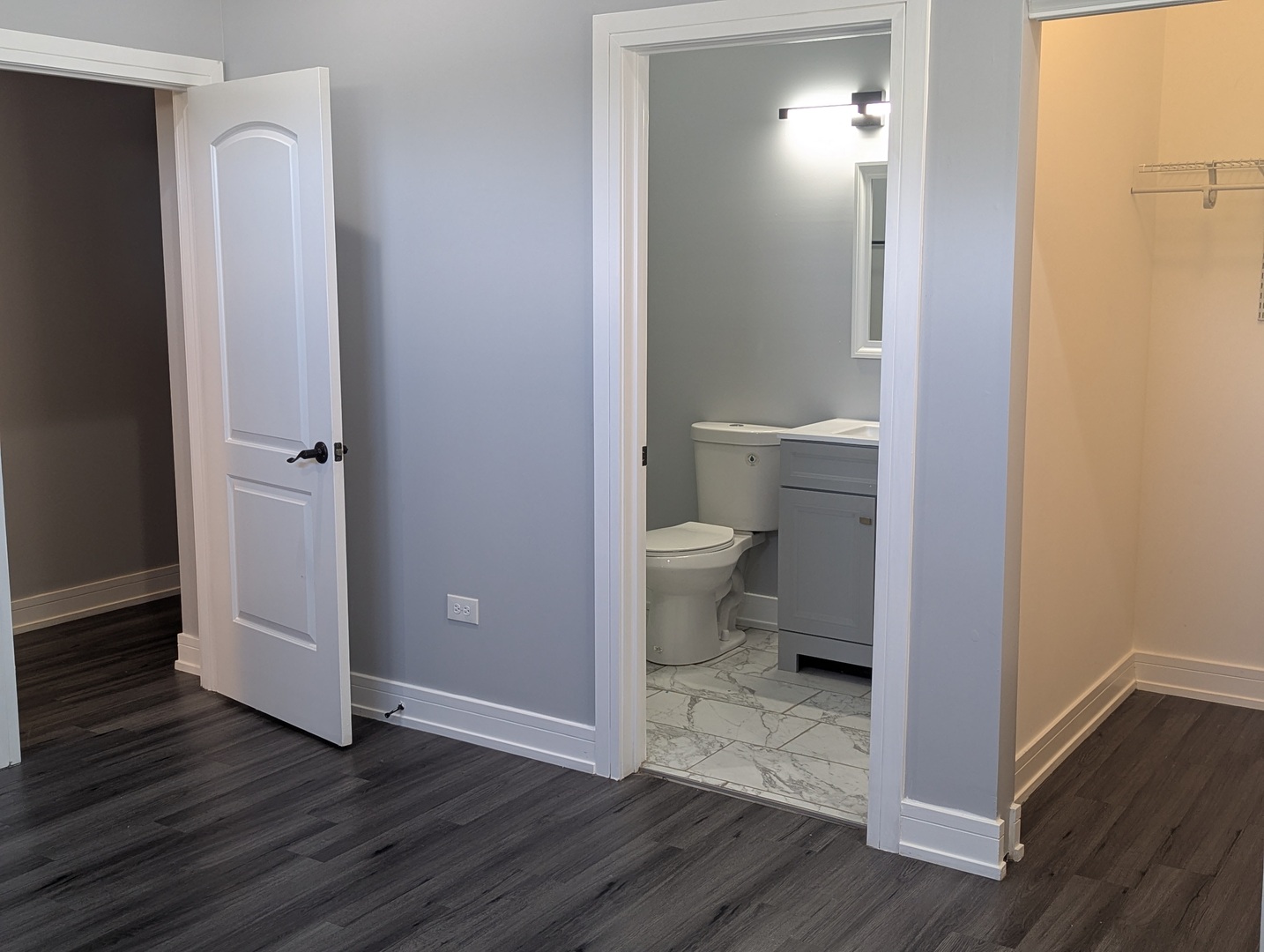3925 South Indiana Avenue, Unit 3 Chicago, IL 60653 - Photo 10 of 11 a bathroom view of a toilet and a wooden floor