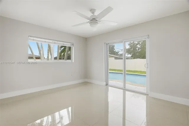 a view of empty room with a fireplace