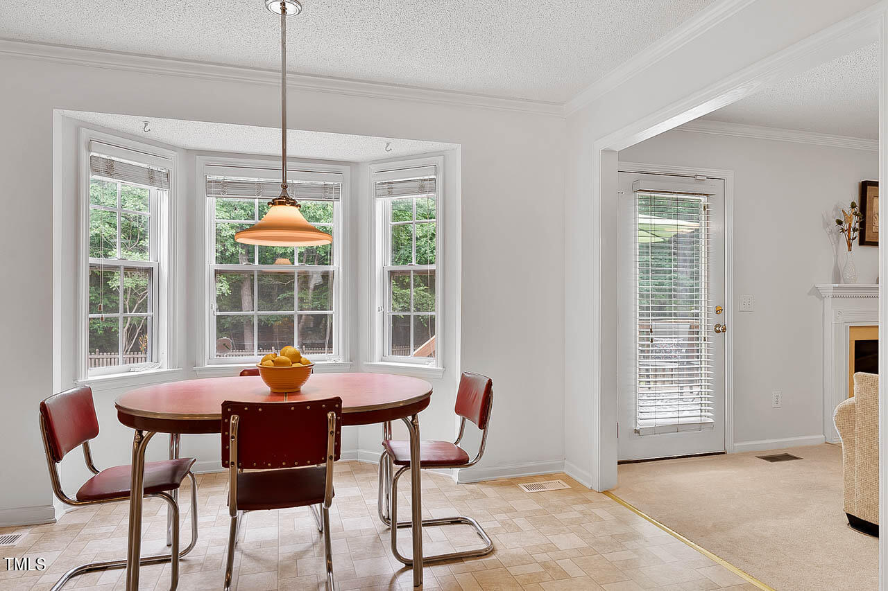 1060 Alderman Circle Raleigh, NC 27603 - Photo 12 of 30 a view of a dining room with furniture window and outside view