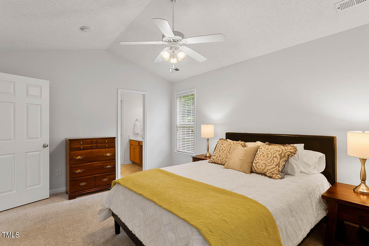 1060 Alderman Circle Raleigh, NC 27603 - Photo 15 of 30 a bedroom with a bed and a dresser