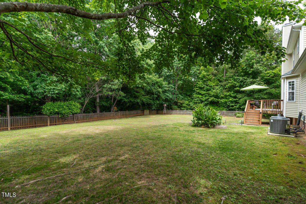 1060 Alderman Circle Raleigh, NC 27603 - Photo 23 of 30 a view of a backyard with a garden