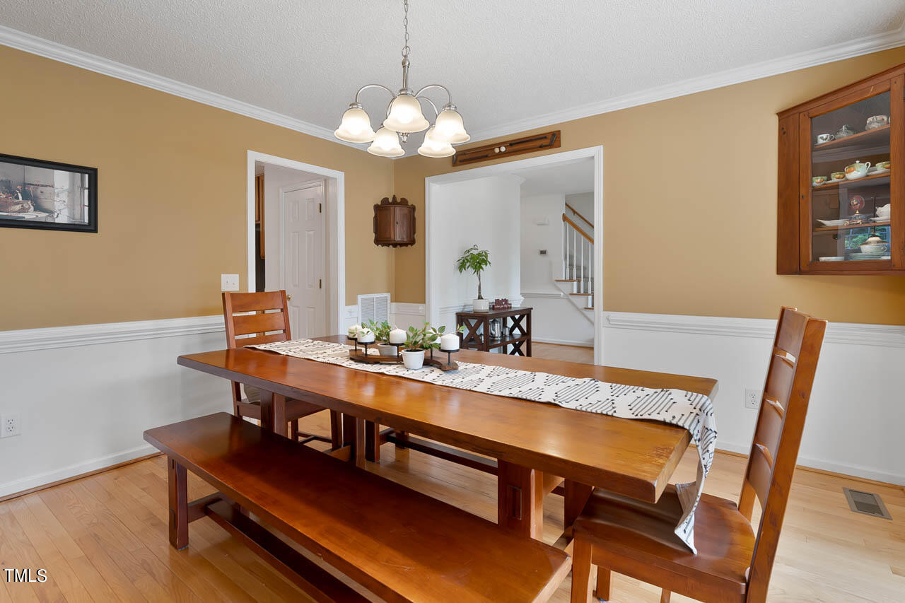 1060 Alderman Circle Raleigh, NC 27603 - Photo 5 of 30 a view of a dining room with furniture