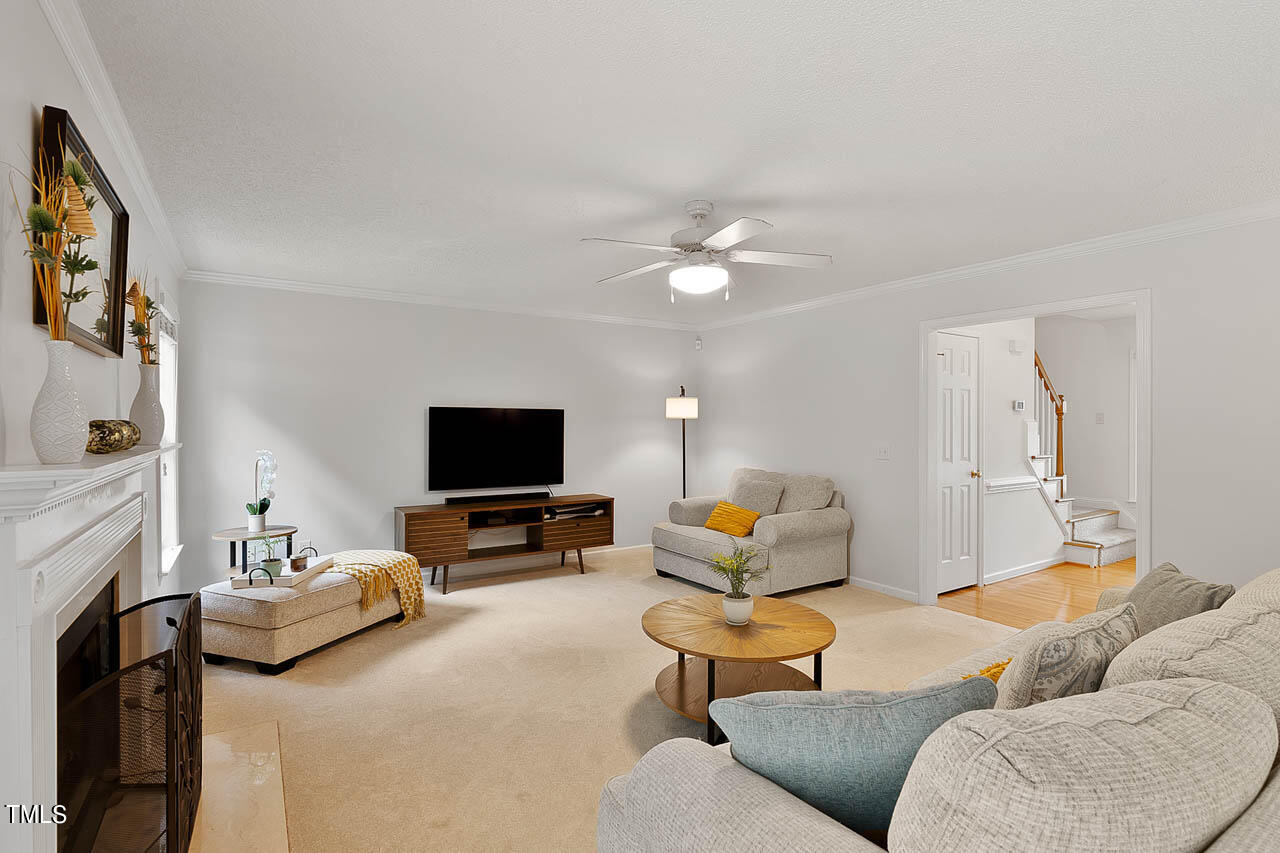 1060 Alderman Circle Raleigh, NC 27603 - Photo 7 of 30 a living room with furniture and a flat screen tv
