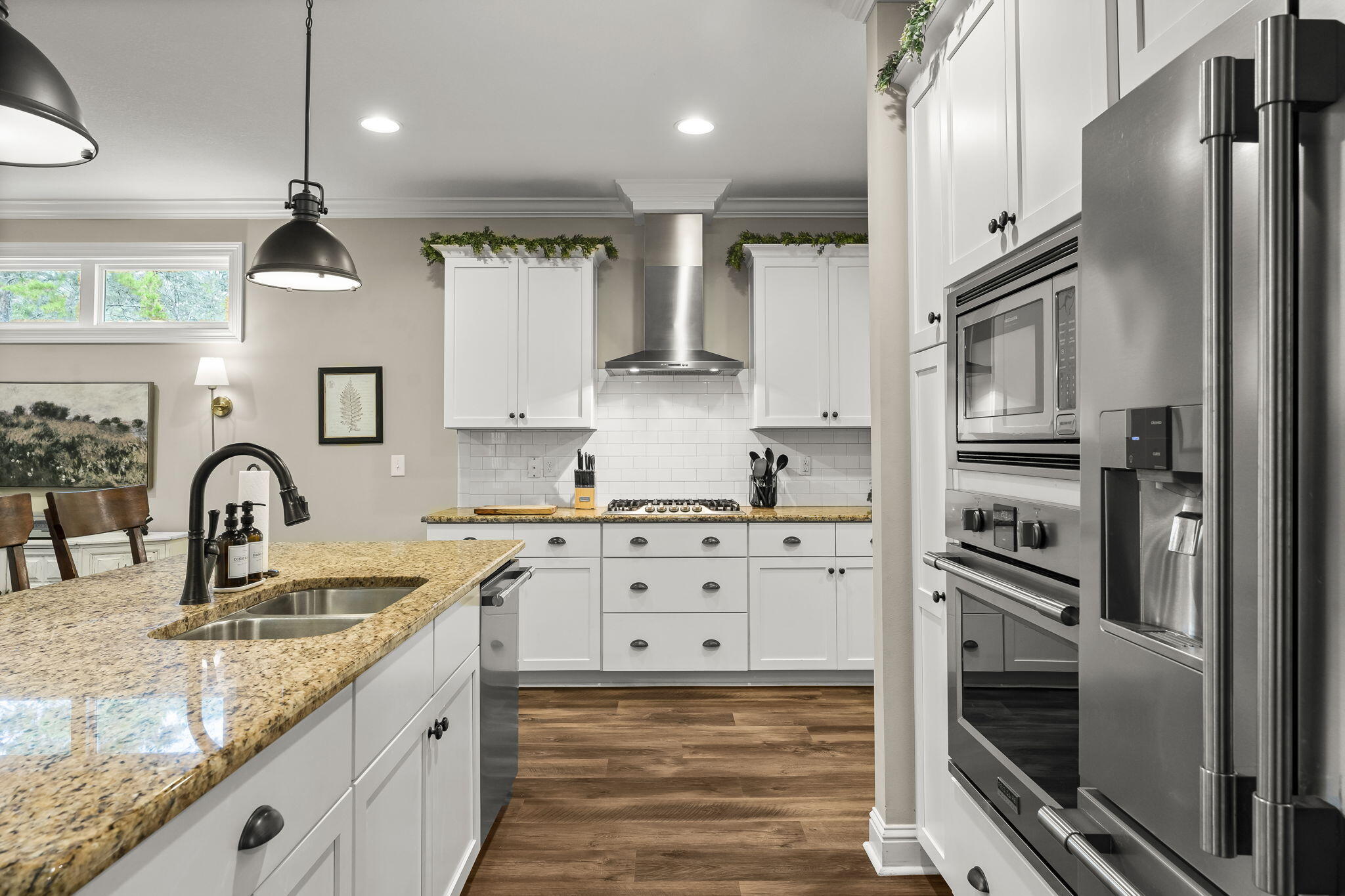 51 Leap Year Lane Freeport, FL 32439 - Photo 15 of 75 a kitchen with stainless steel appliances granite countertop a sink refrigerator and cabinets