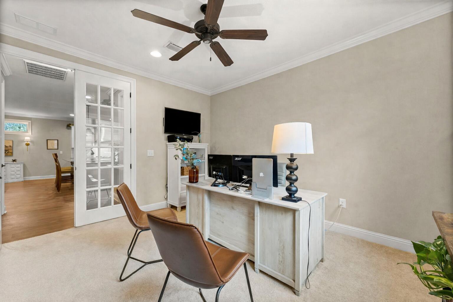 51 Leap Year Lane Freeport, FL 32439 - Photo 21 of 75 a dining room with furniture and a flat screen tv