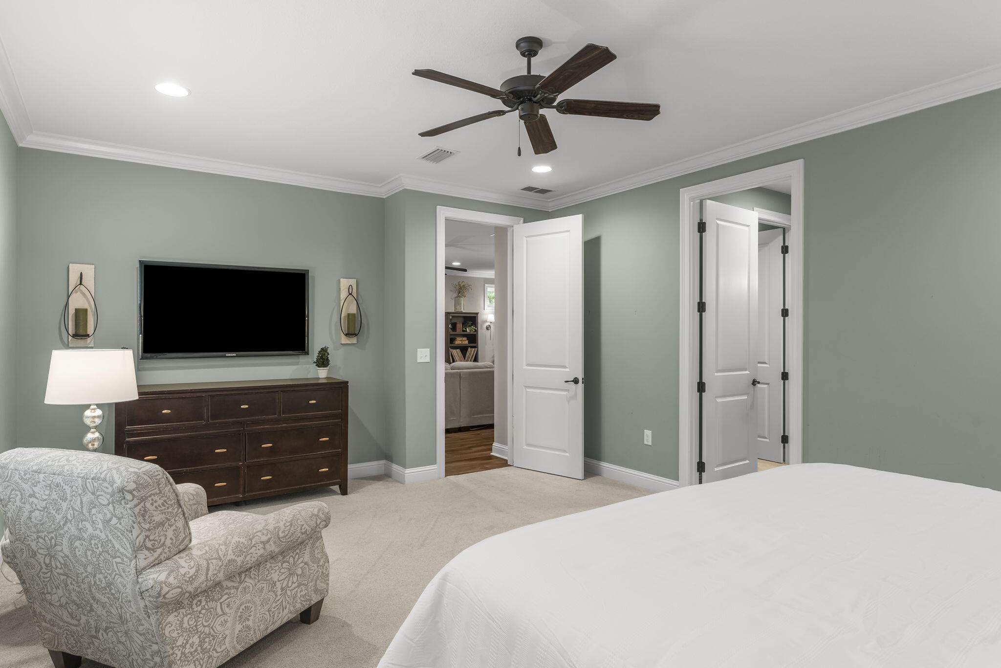 51 Leap Year Lane Freeport, FL 32439 - Photo 30 of 75 a bedroom with a bed and a flat screen tv