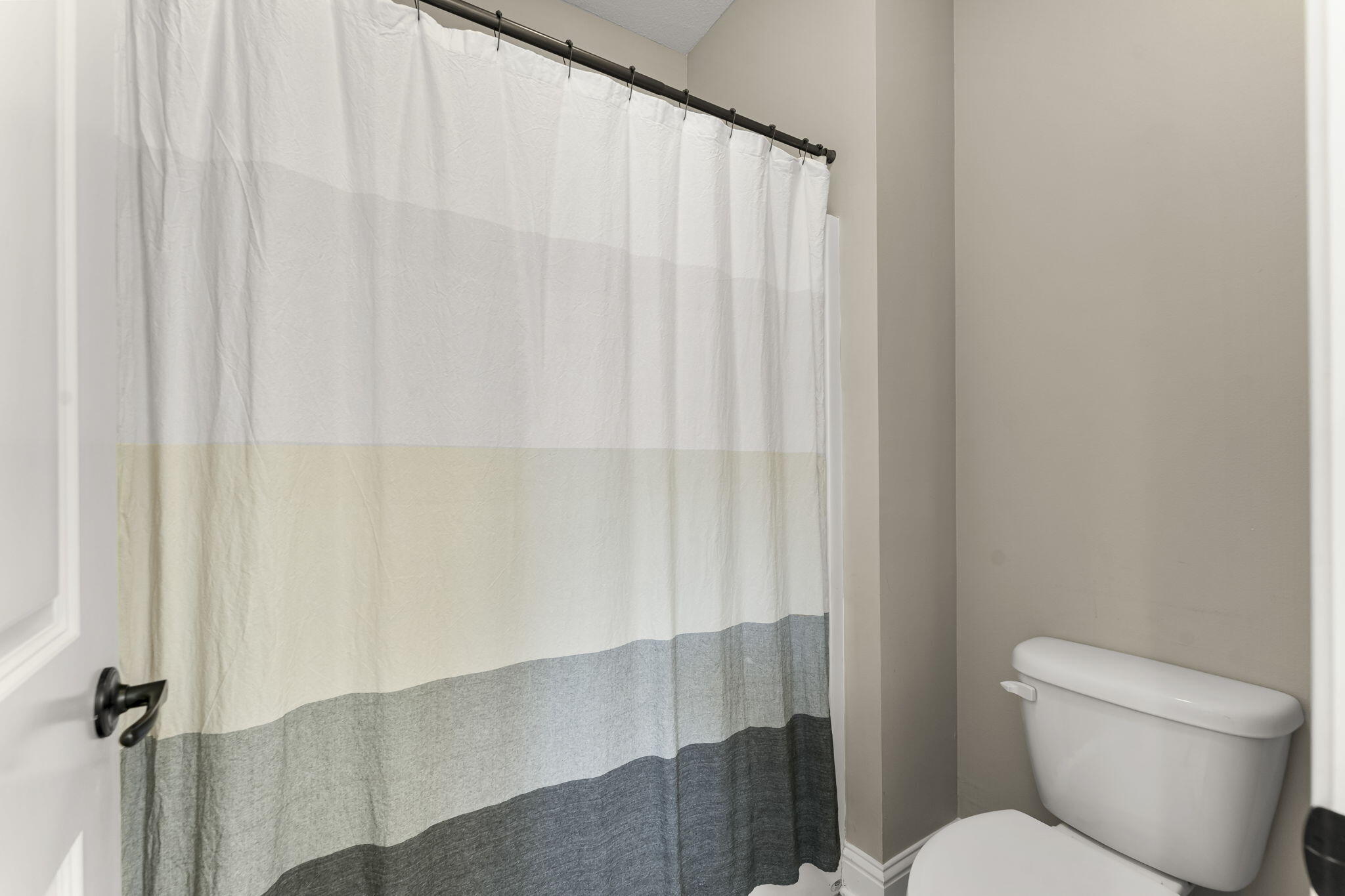 51 Leap Year Lane Freeport, FL 32439 - Photo 9 of 75 a white toilet sitting next to a shower