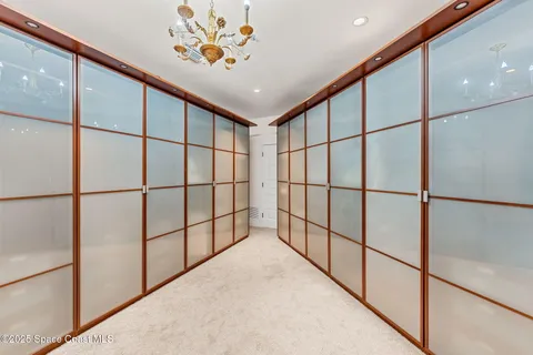 a spacious bedroom with a bed and a couch