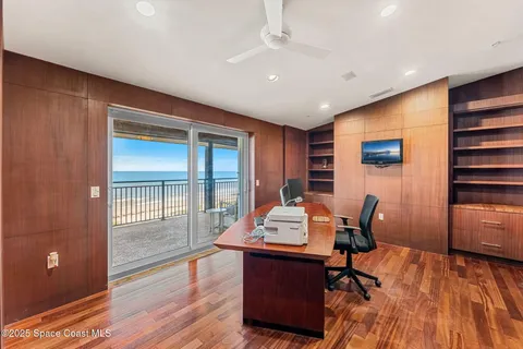 a bedroom with a large bed and a couch