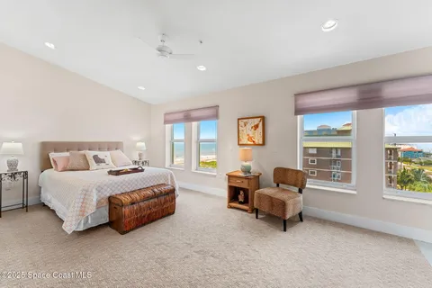a bathroom with a granite countertop sink a mirror and shower