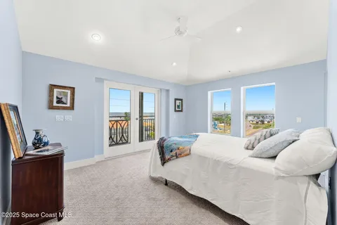 a utility room with dryer washer and a fridge
