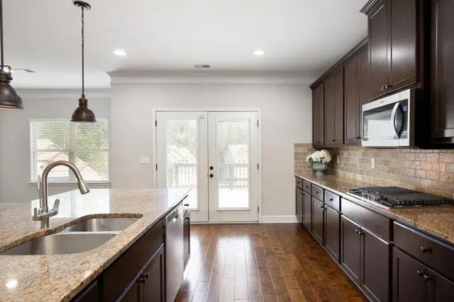 a view of a room with window and wooden floor