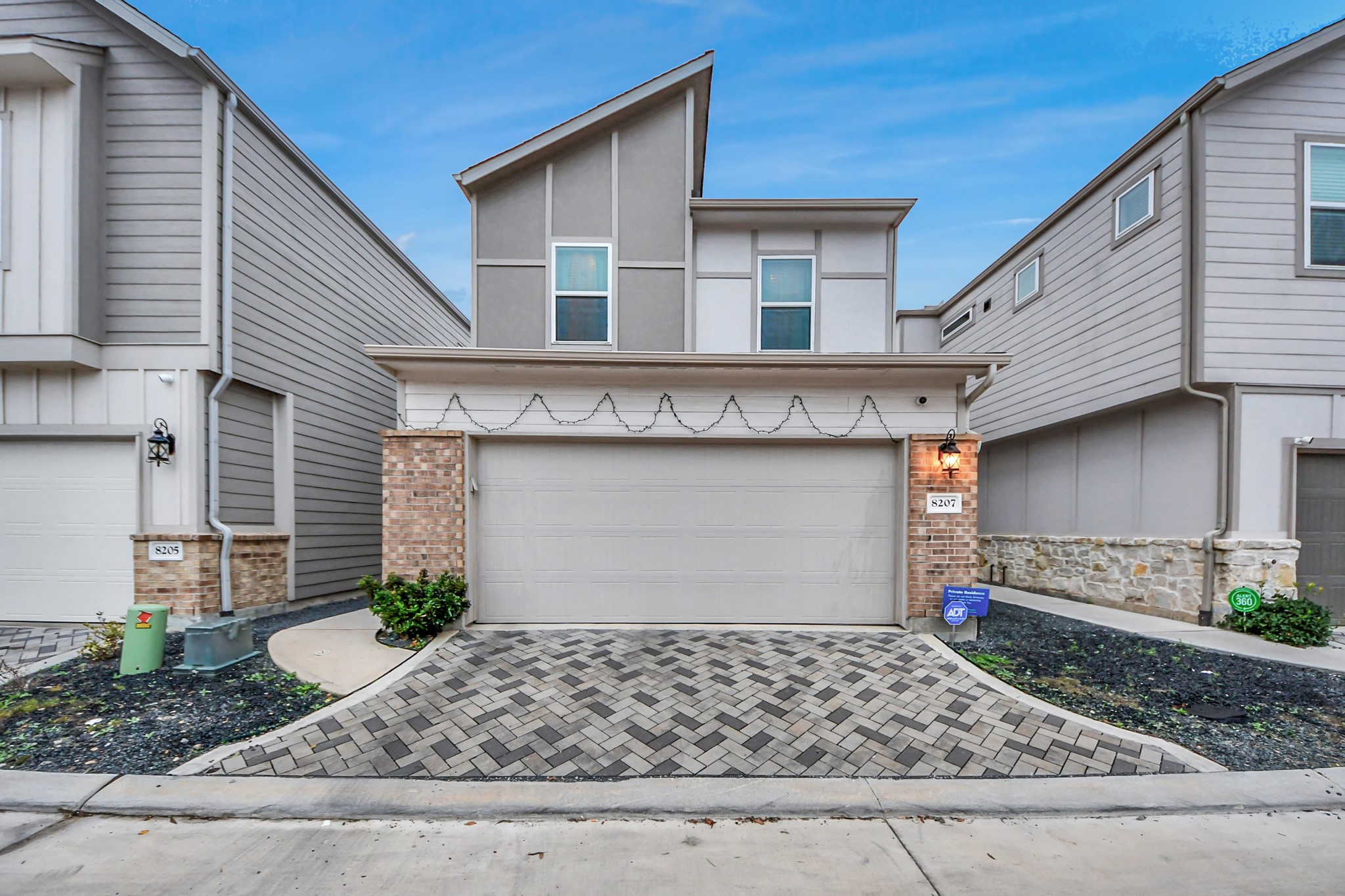 8207 Rising Stream Drive Houston, TX 77063 - Photo 1 of 50 a front view of a house with garage