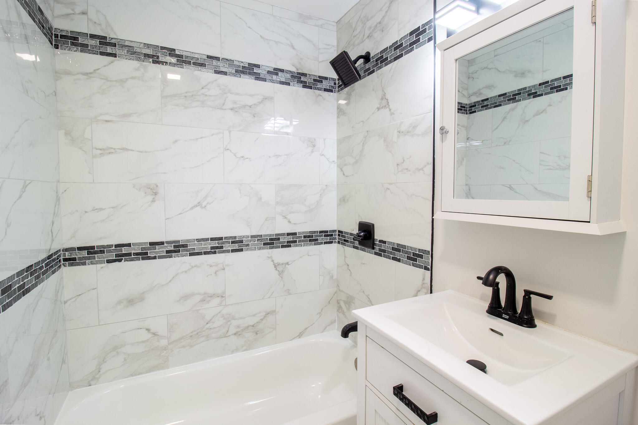 1755 Ralston Street Gary, IN 46406 - Photo 15 of 29 a bathroom with a shower and a sink window