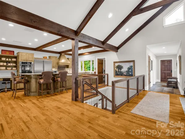 a kitchen with stainless steel appliances granite countertop a stove and cabinets