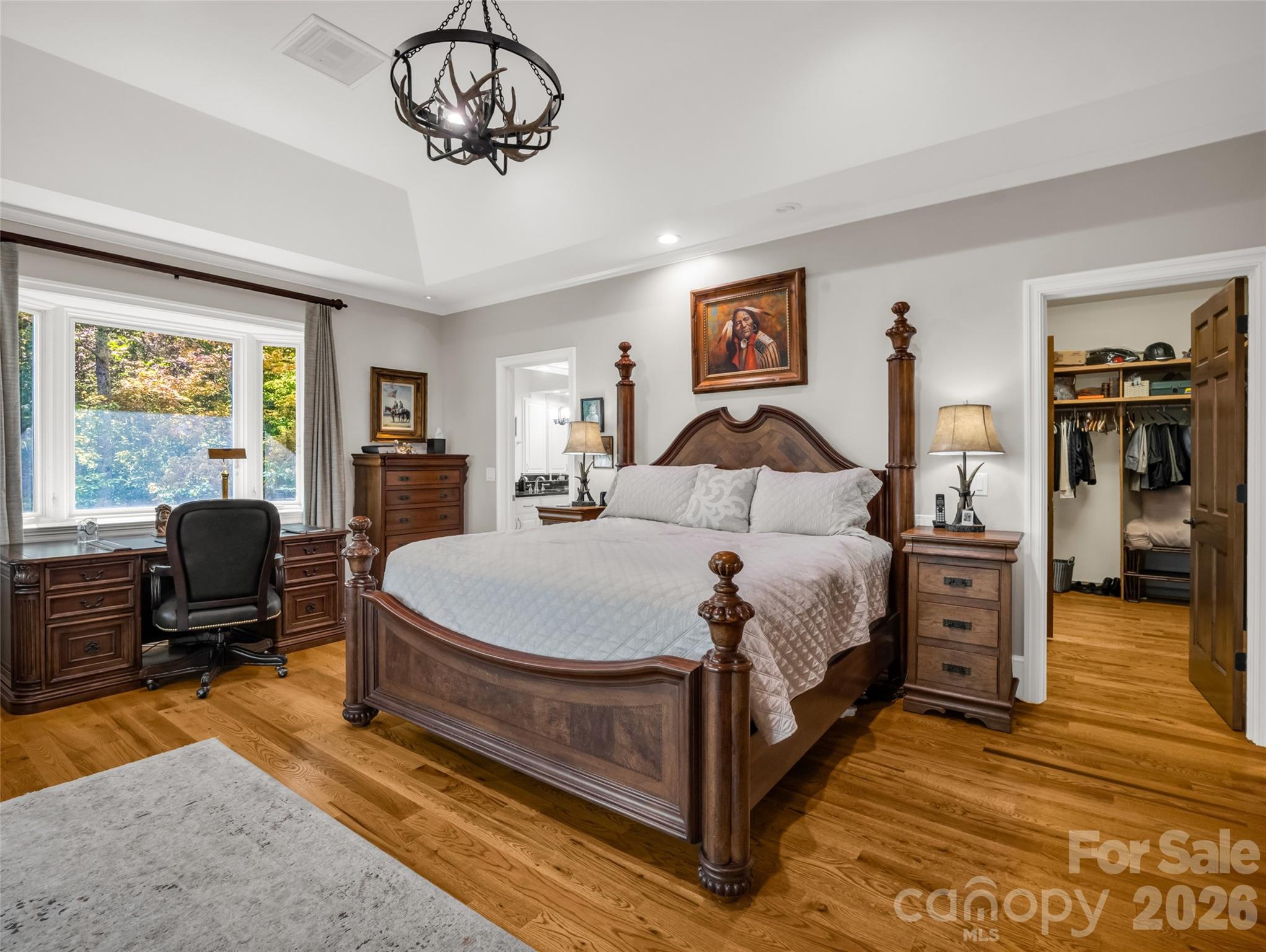 2435 Deep Gap Farm Road East Mill Spring, NC 28756 - Photo 17 of 42 a bedroom with a bed dresser and a window