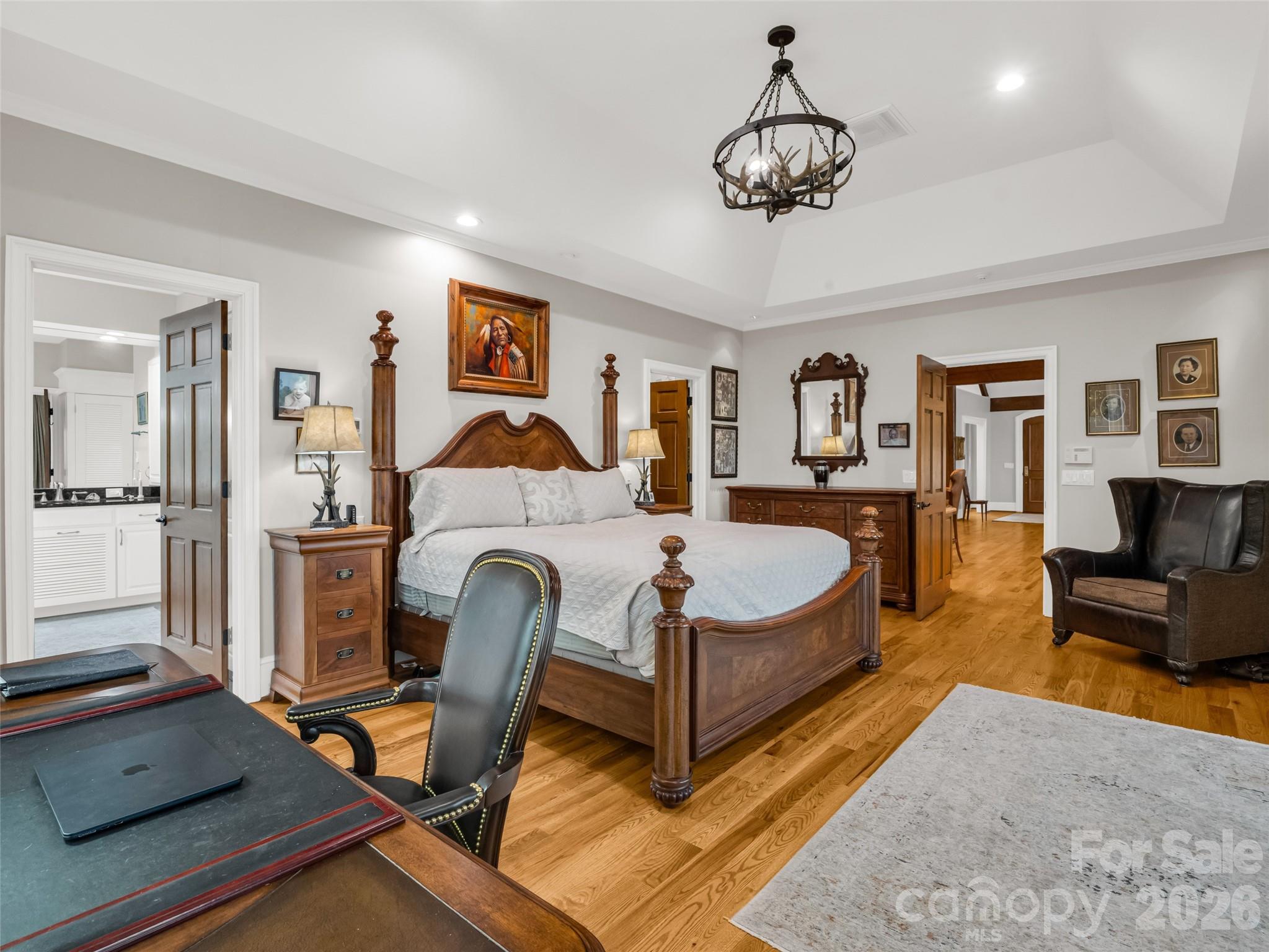 2435 Deep Gap Farm Road East Mill Spring, NC 28756 - Photo 18 of 42 a bedroom with a bed a couch and dresser