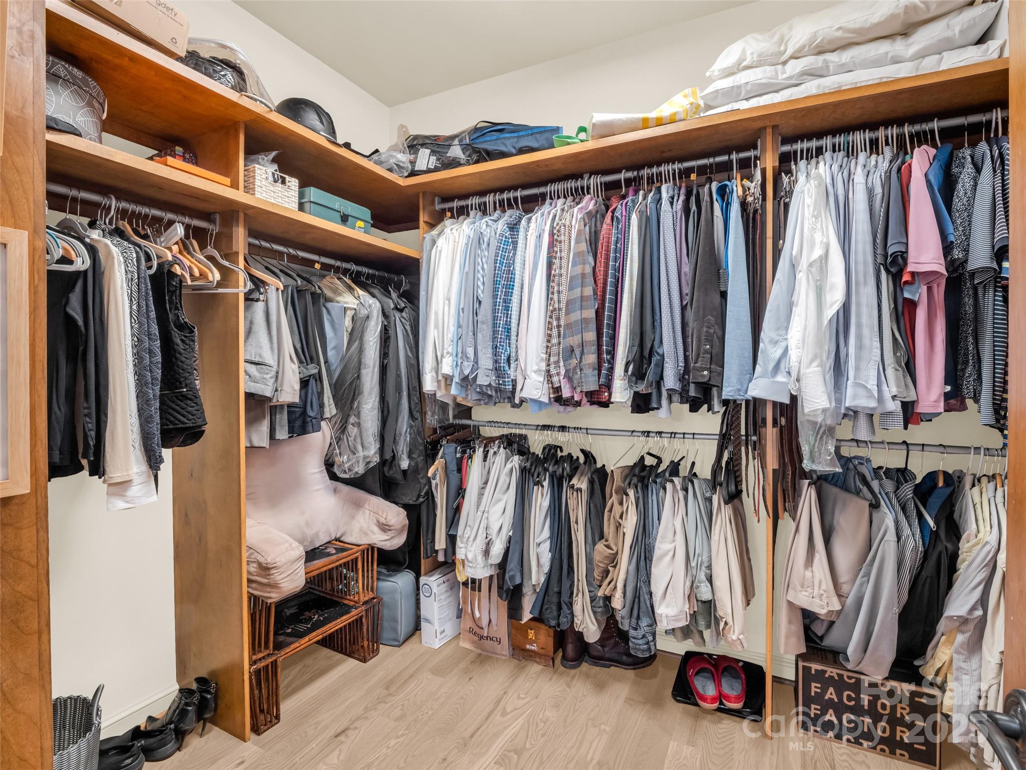 2435 Deep Gap Farm Road East Mill Spring, NC 28756 - Photo 21 of 44 a view of walk in closet with clothes