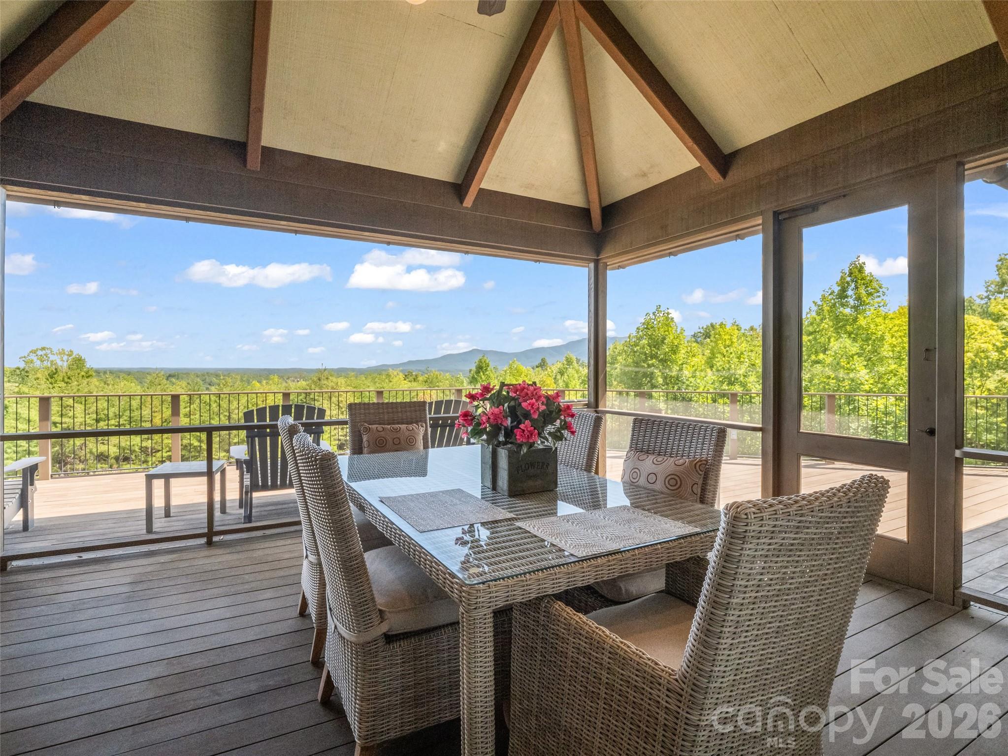 2435 Deep Gap Farm Road East Mill Spring, NC 28756 - Photo 21 of 42 a view of a dining room with furniture window and outside view