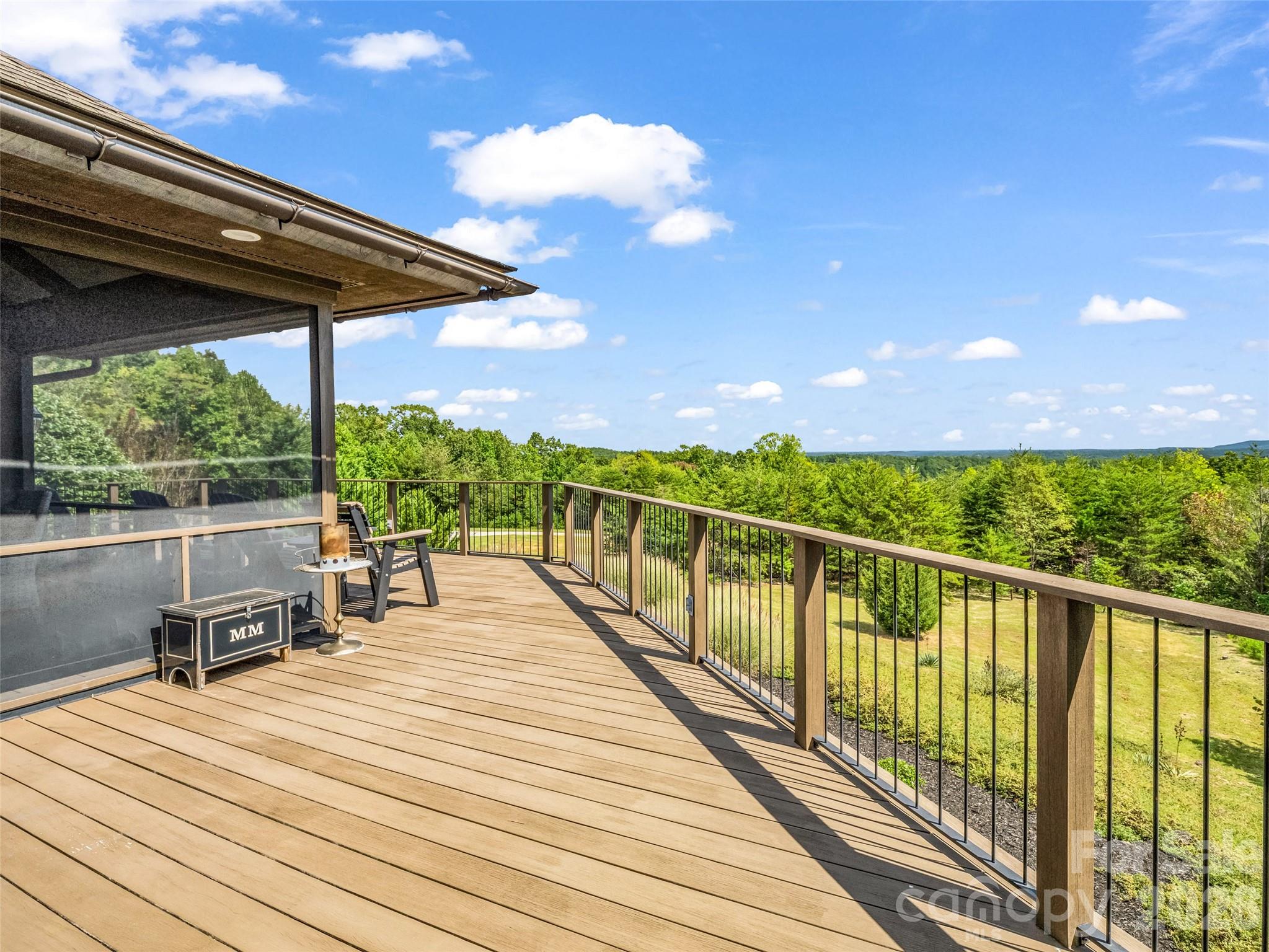 2435 Deep Gap Farm Road East Mill Spring, NC 28756 - Photo 22 of 42 a view of a balcony with chairs