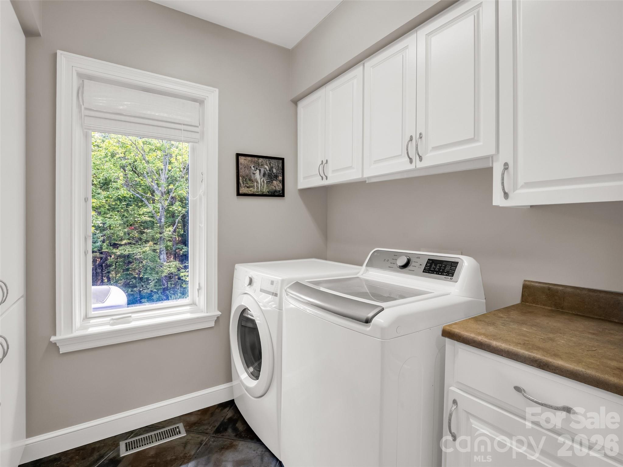2435 Deep Gap Farm Road East Mill Spring, NC 28756 - Photo 26 of 42 a utility room with dryer and washer
