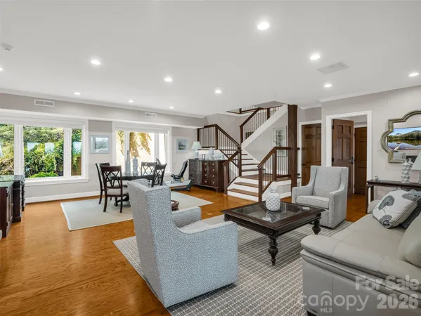 a spacious bathroom with a granite countertop sink mirror and shower