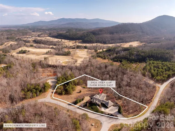 a view of a small pool with a yard