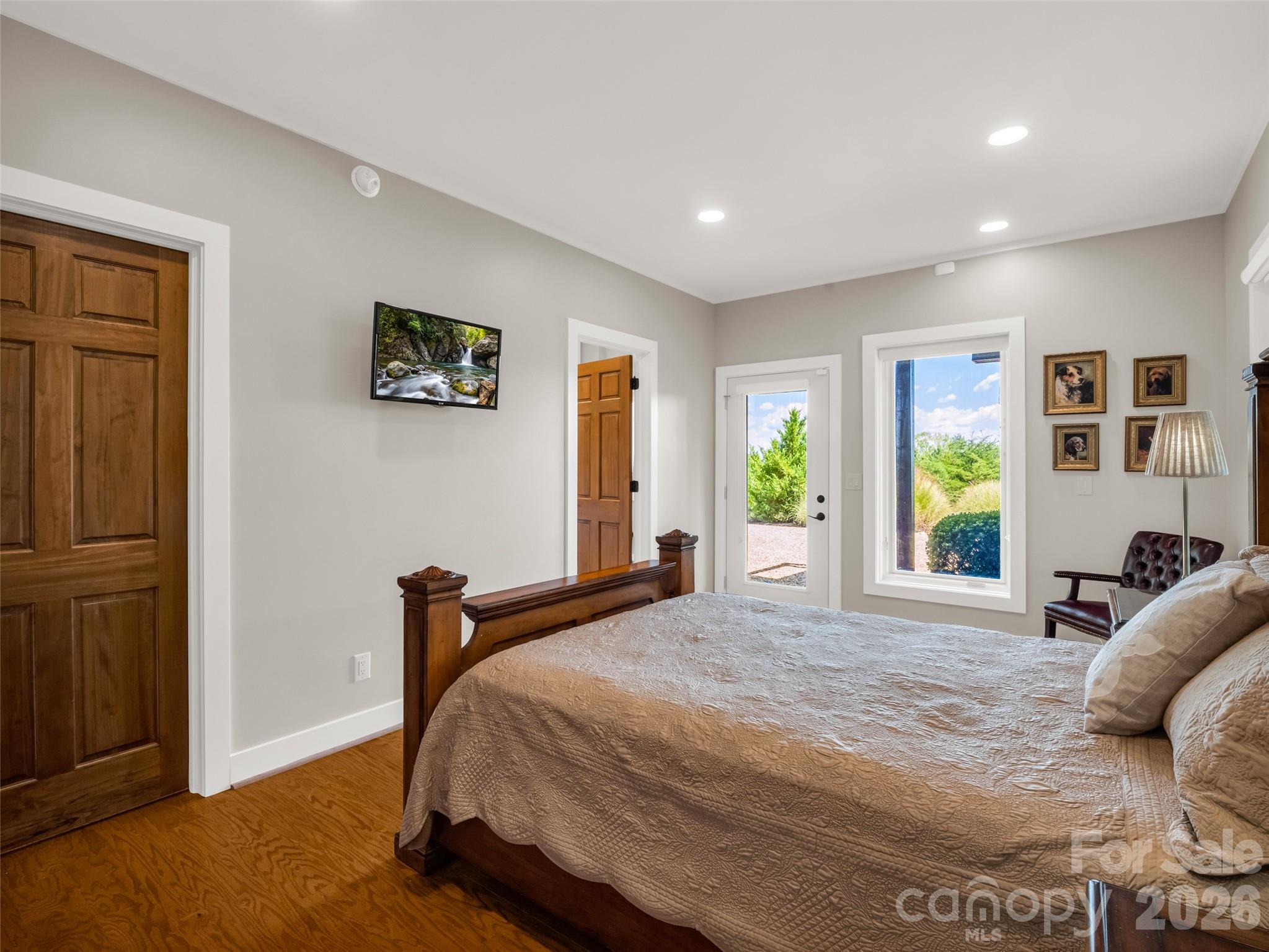 2435 Deep Gap Farm Road East Mill Spring, NC 28756 - Photo 35 of 42 a bedroom with a bed and a window