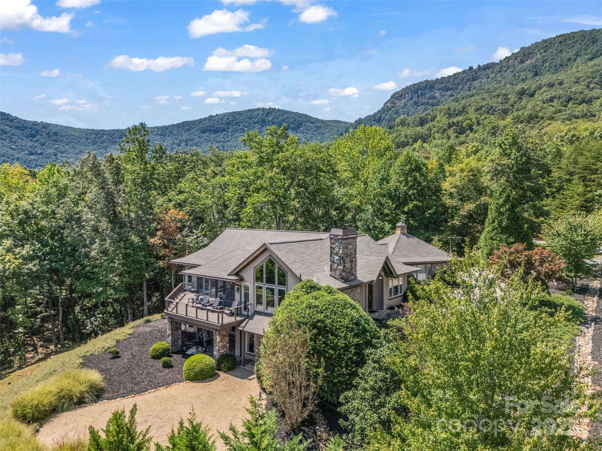 2435 Deep Gap Farm Road East Mill Spring, NC 28756 - Photo 41 of 44 a house view with a garden space