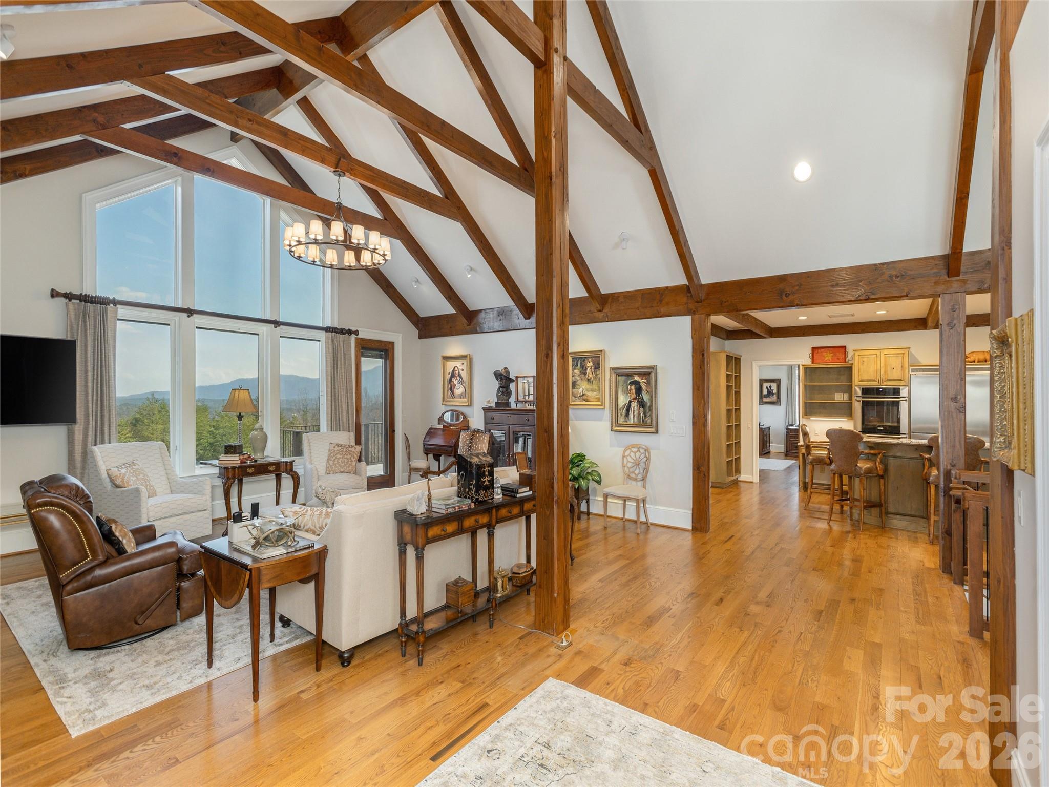 2435 Deep Gap Farm Road East Mill Spring, NC 28756 - Photo 7 of 42 a living room with furniture and a large window