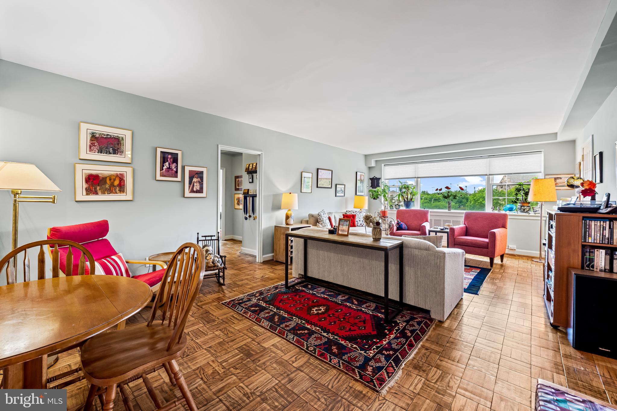 3601 Greenway, Unit 705 Baltimore, MD 21218 - Photo 5 of 30 a living room with furniture and a window