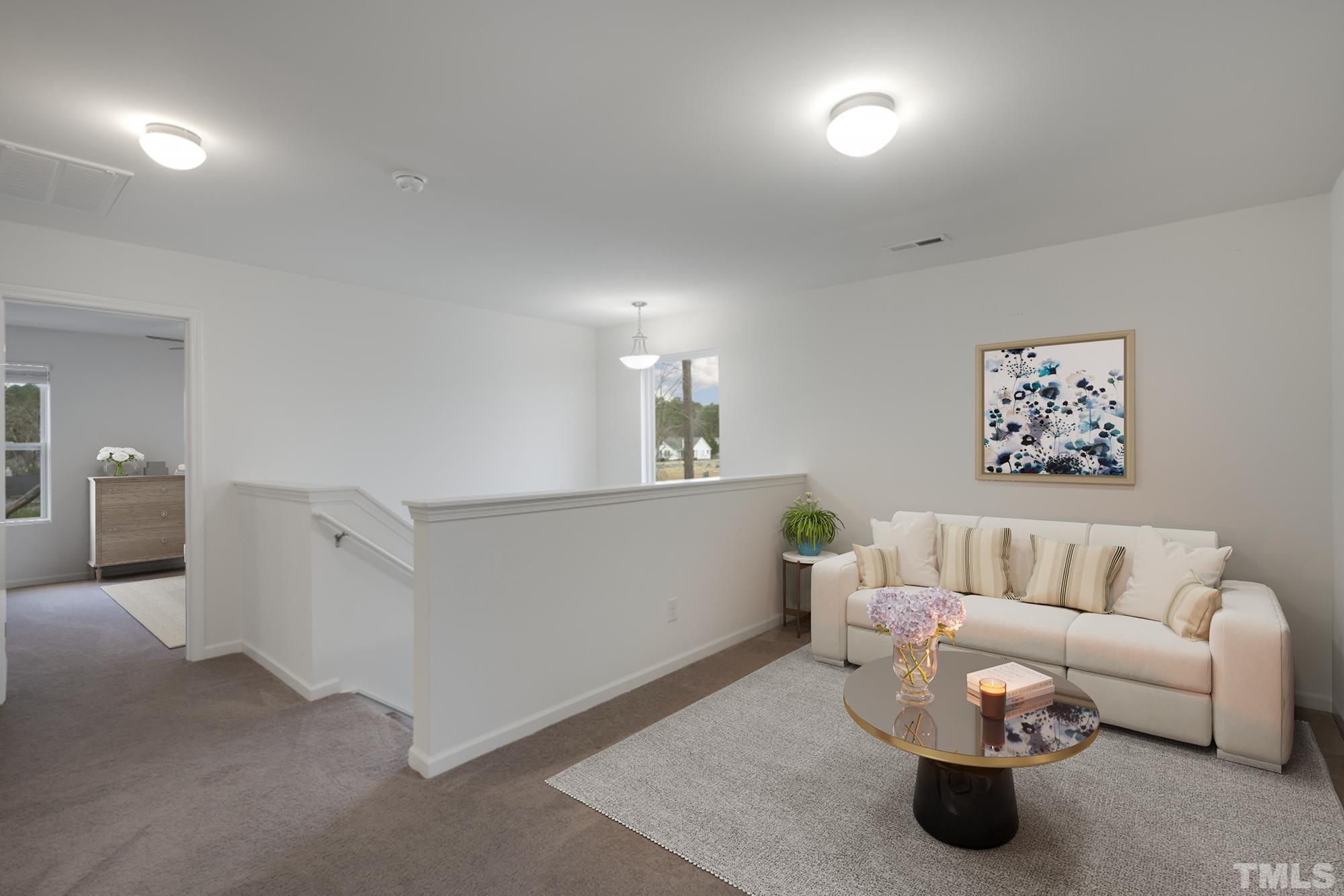 309 Connect Drive Wendell, NC 27591 - Photo 16 of 29 a living room with furniture and a couch
