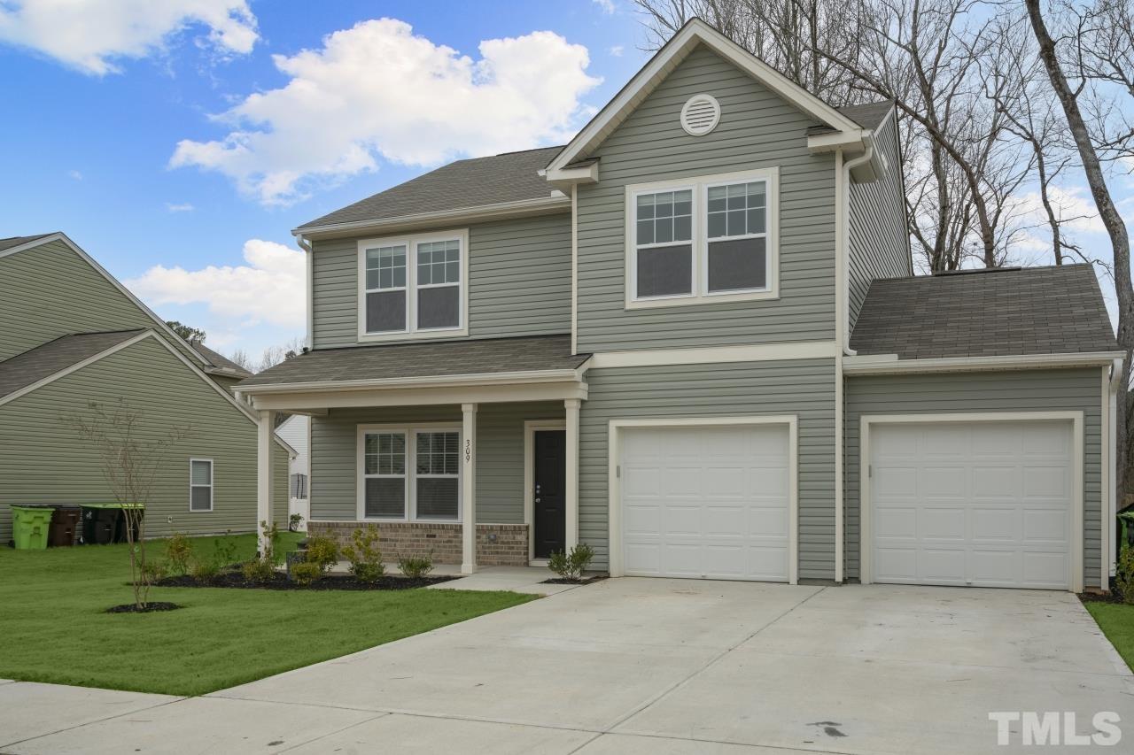 309 Connect Drive Wendell, NC 27591 - Photo 3 of 29 a front view of a house with garden