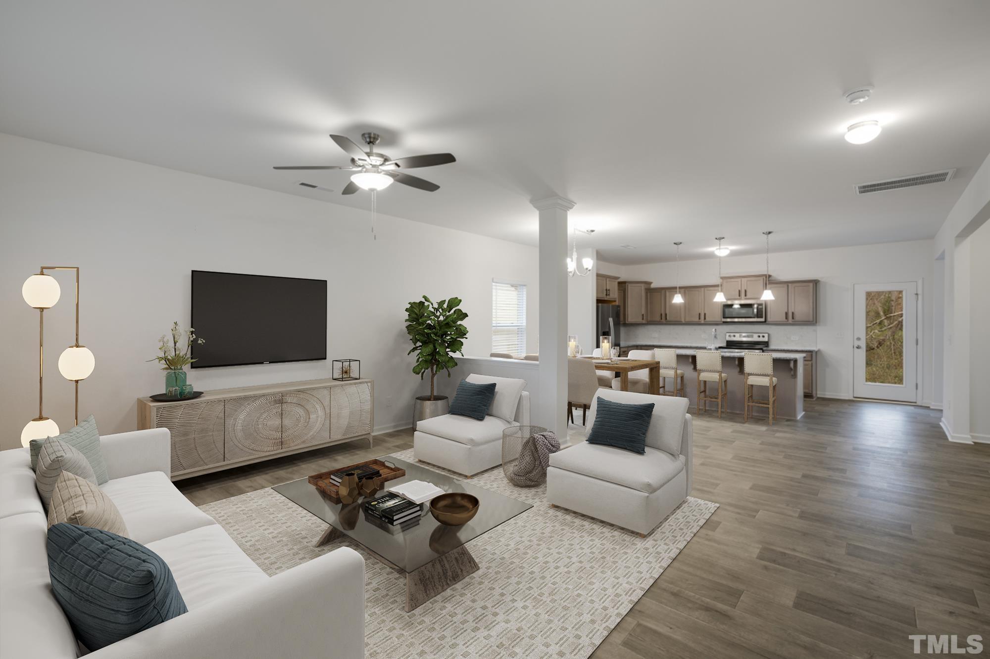 309 Connect Drive Wendell, NC 27591 - Photo 4 of 29 a living room with furniture and a flat screen tv