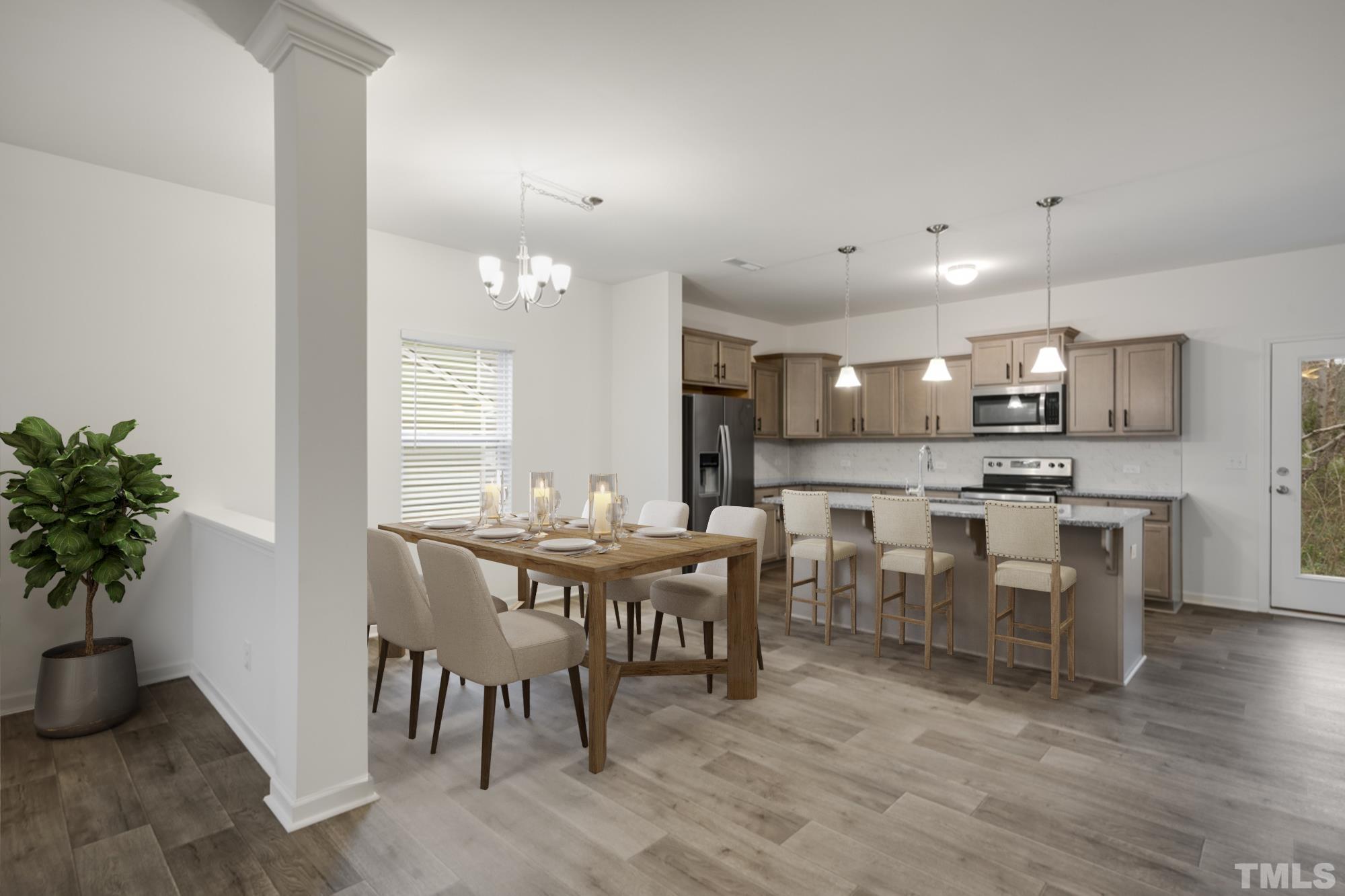 309 Connect Drive Wendell, NC 27591 - Photo 7 of 29 a view of a dining room with furniture