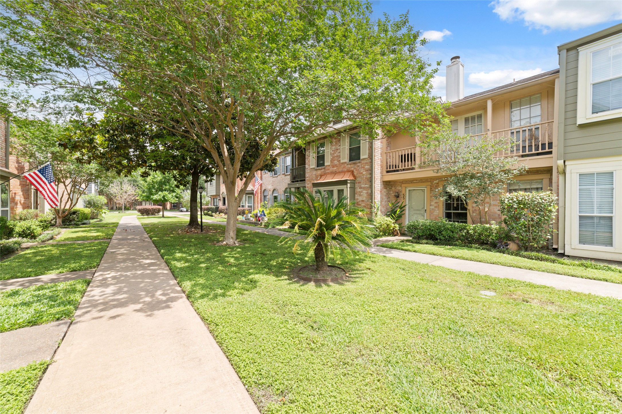 5800 Lumberdale Road, Unit 55 Houston, TX 77092 - Photo 25 of 34 a front view of a house with a yard