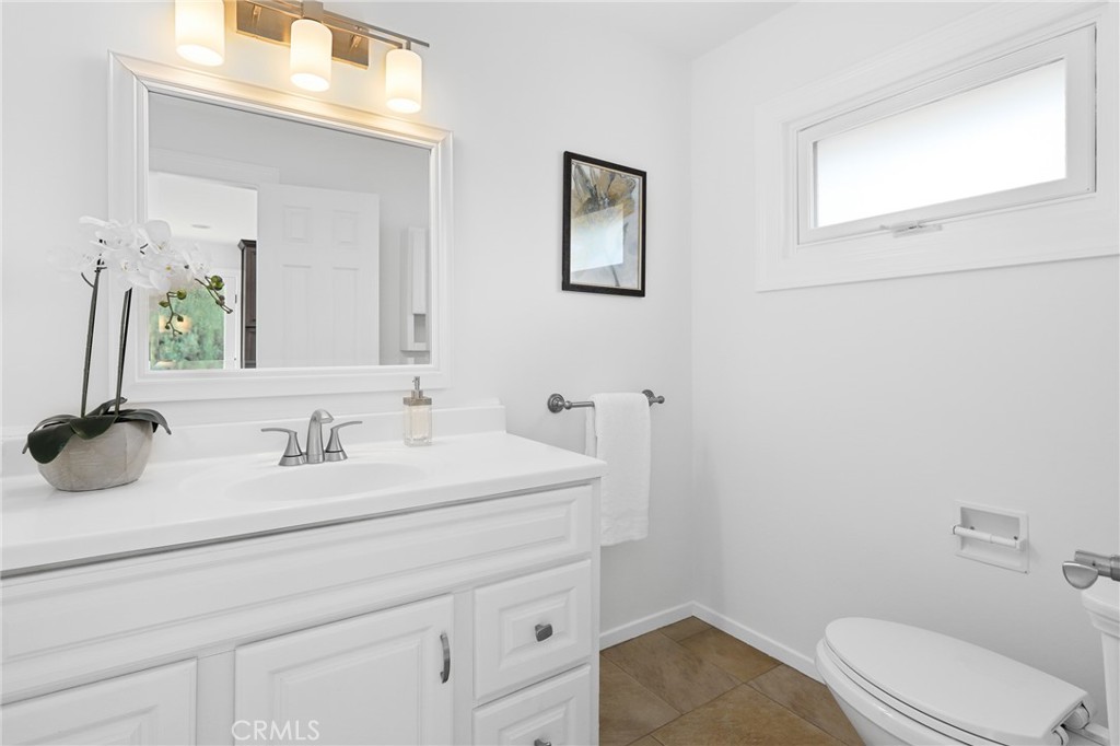 190 Lilac Lane Brea, CA 92823 - Photo 19 of 72 a bathroom with a sink a toilet and mirror