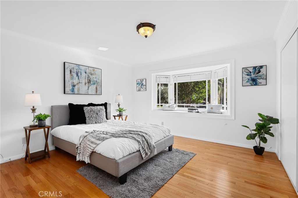 190 Lilac Lane Brea, CA 92823 - Photo 21 of 72 a bedroom with a large bed and a potted plant