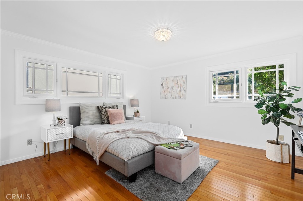 190 Lilac Lane Brea, CA 92823 - Photo 24 of 72 a bedroom with a bed and a potted plant