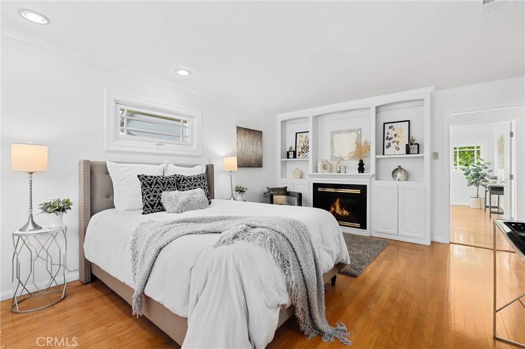 190 Lilac Lane Brea, CA 92823 - Photo 27 of 72 a spacious bedroom with a bed and a flat screen tv