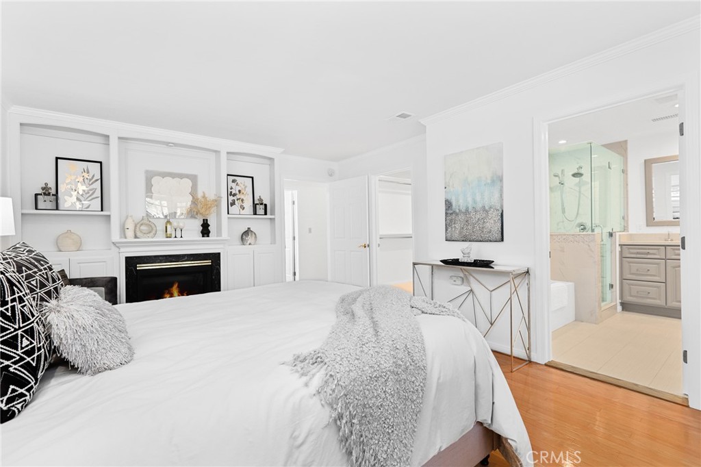 190 Lilac Lane Brea, CA 92823 - Photo 28 of 72 a large bedroom with a bed and glass table