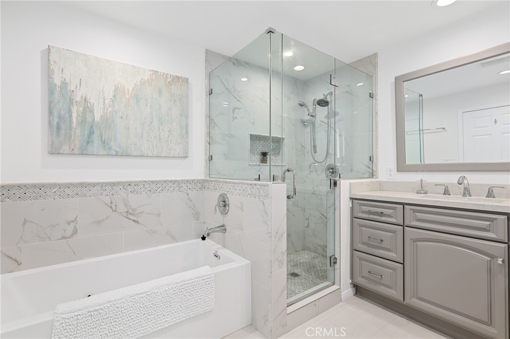 190 Lilac Lane Brea, CA 92823 - Photo 31 of 72 a bathroom with a tub sink and mirror