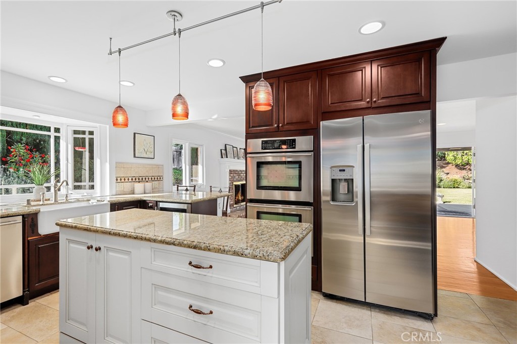 190 Lilac Lane Brea, CA 92823 - Photo 33 of 72 a kitchen with stainless steel appliances granite countertop a refrigerator a oven and a sink