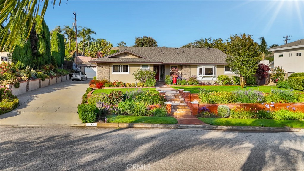 190 Lilac Lane Brea, CA 92823 - Photo 54 of 72 a front view of a house with a yard and potted plants