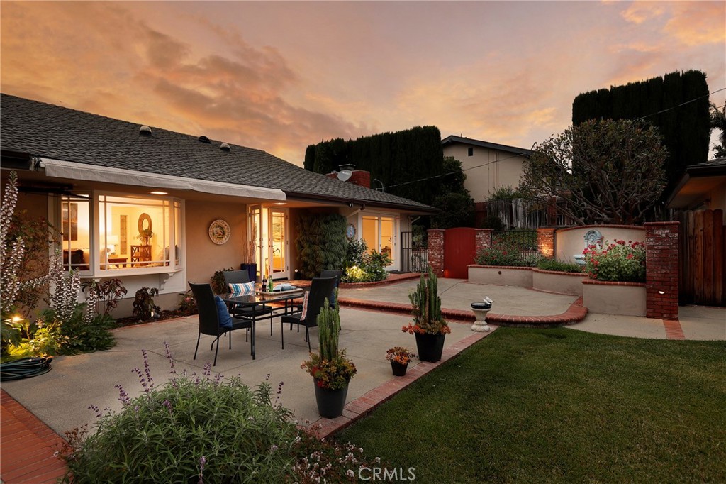 190 Lilac Lane Brea, CA 92823 - Photo 66 of 72 a view of a patio with table and chairs potted plants with floor to ceiling window