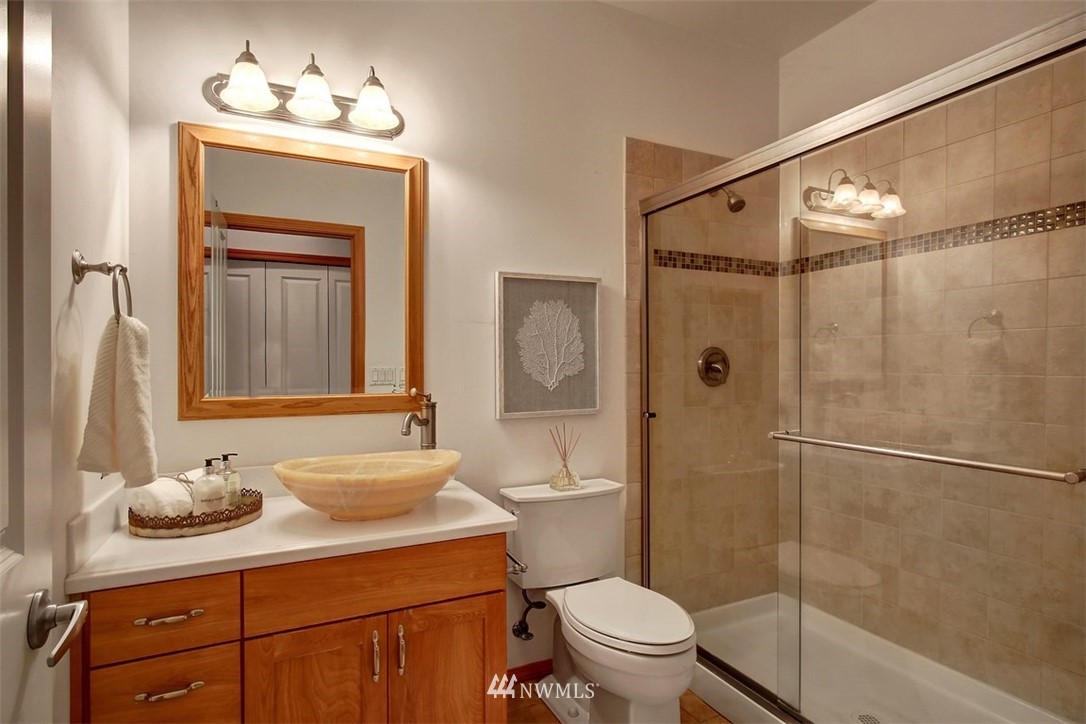 11225 Renton Issaquah Road Southeast Issaquah, WA 98027 - Photo 11 of 21 a bathroom with a sink a toilet and shower