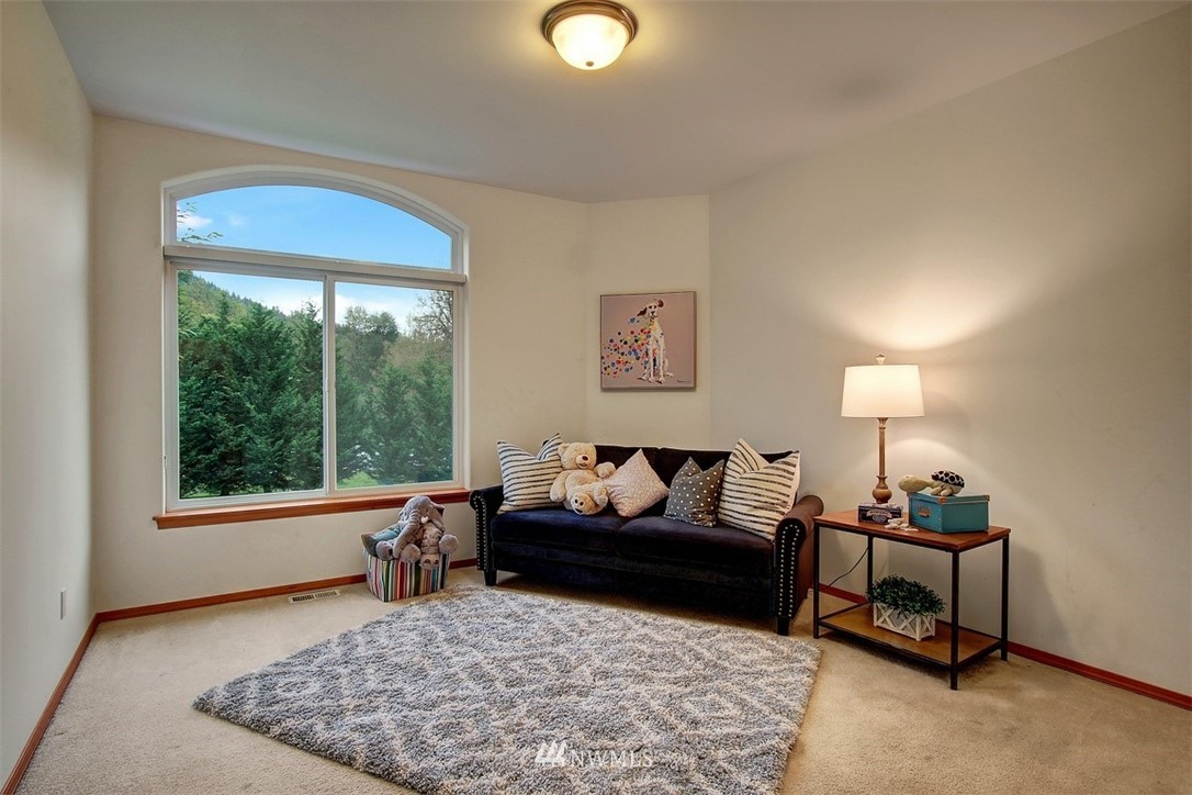 11225 Renton Issaquah Road Southeast Issaquah, WA 98027 - Photo 15 of 21 a living room with furniture and a window