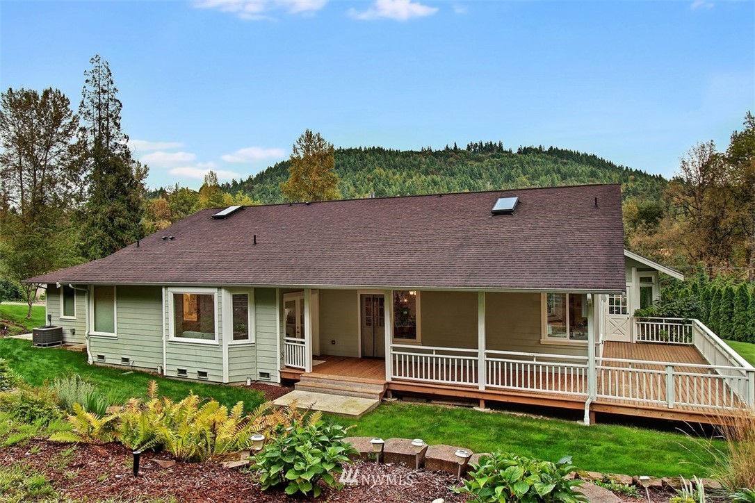 11225 Renton Issaquah Road Southeast Issaquah, WA 98027 - Photo 17 of 21 a front view of a house with a garden