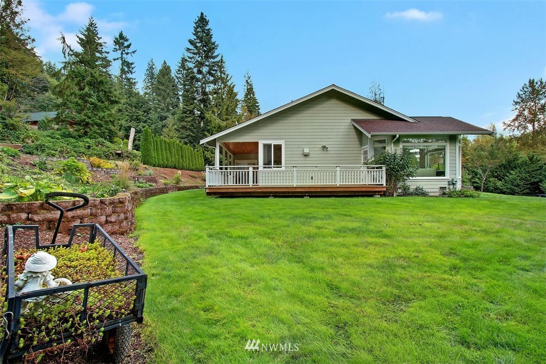 11225 Renton Issaquah Road Southeast Issaquah, WA 98027 - Photo 18 of 21 a view of a house with backyard and garden
